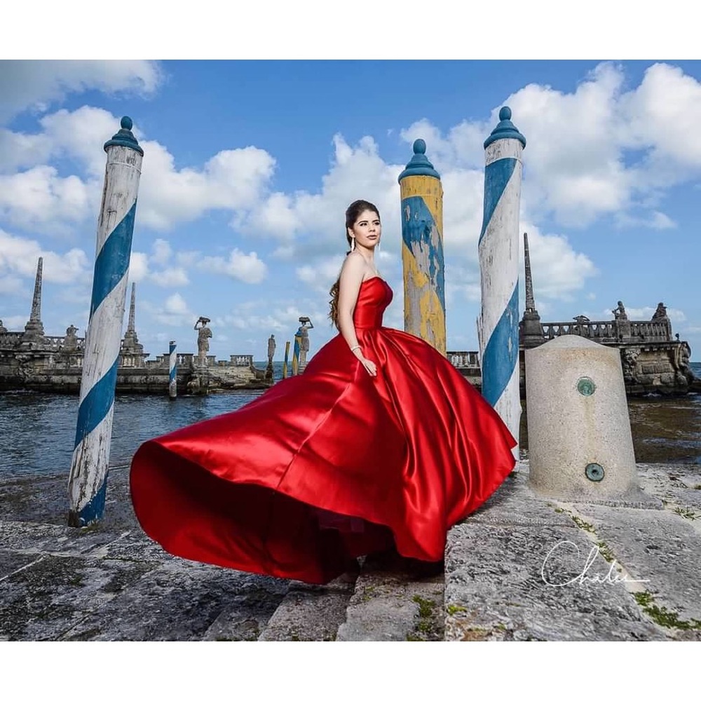 Strapless red floor length ball gown. Satin feel. Size 2.